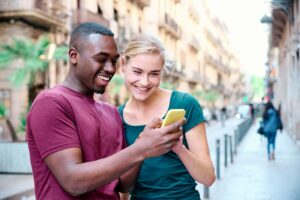 young interracial couple using a mobile phone